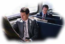 businessmen reading newspapers on the subway